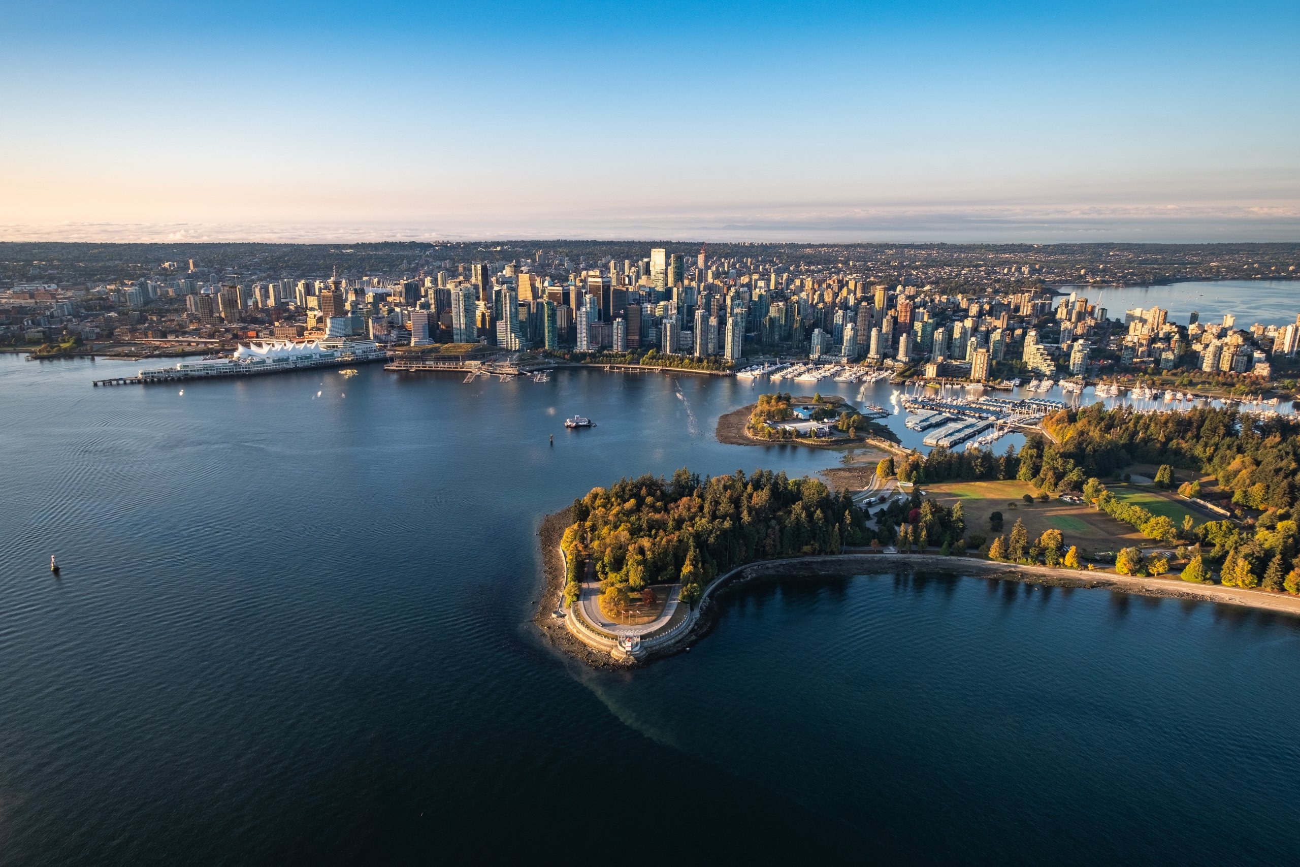 Aerial image shot by Albert Normandin showing a view with Stanley park in the foreground and Downtown Vancouver in the background.
