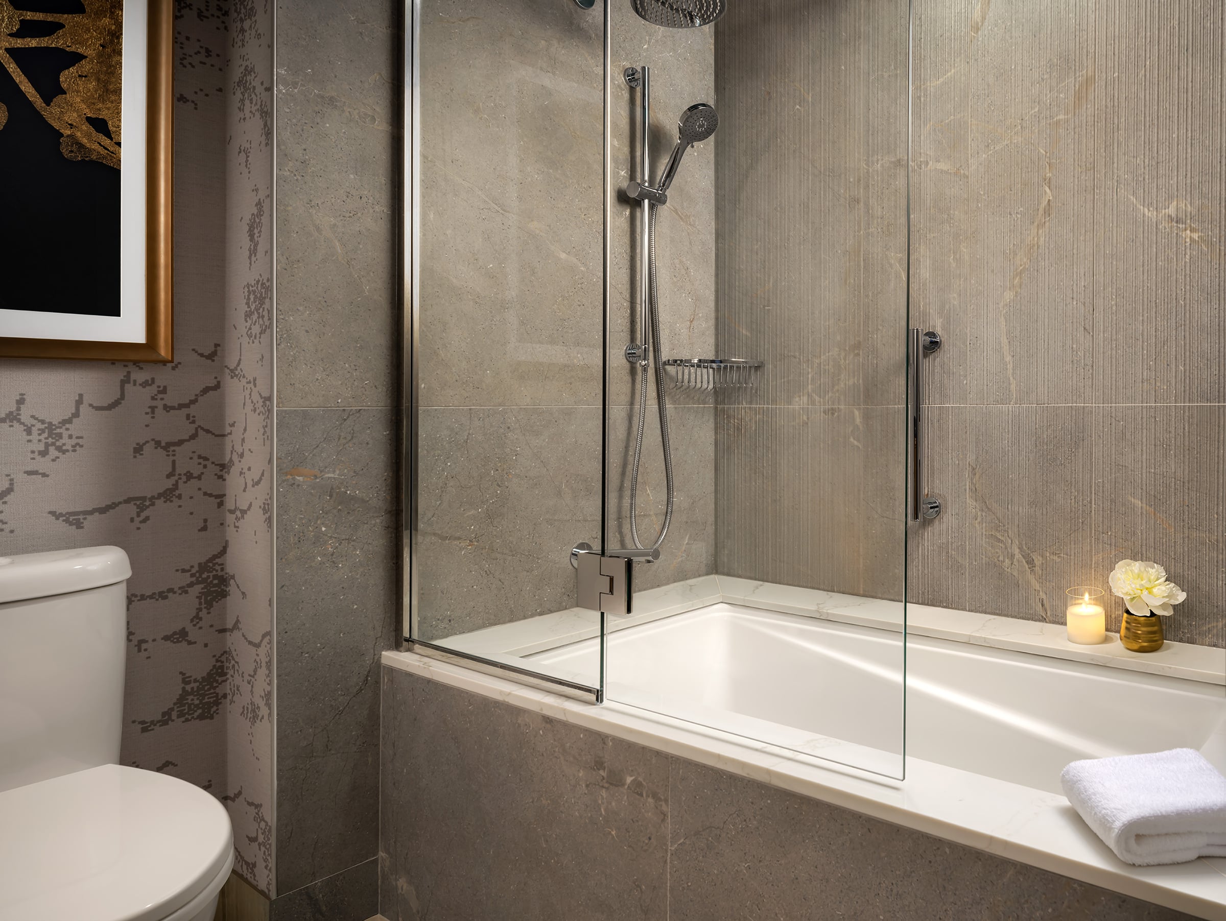 Newly renovated bathroom at Fairmont Waterfront with bathtub and shower combination, refined coastal design, and clean, contemporary finishes, creating a bright and comfortable space in downtown Vancouver.