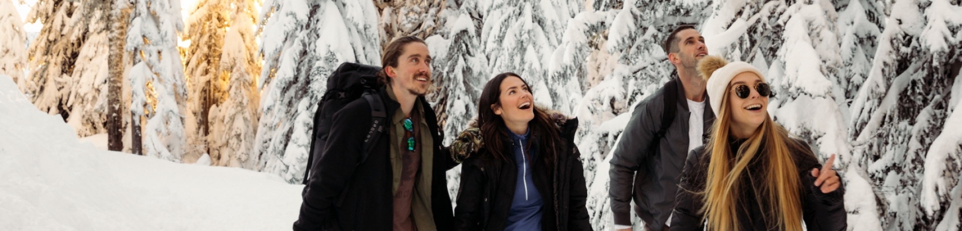 four people on a mountain in winter