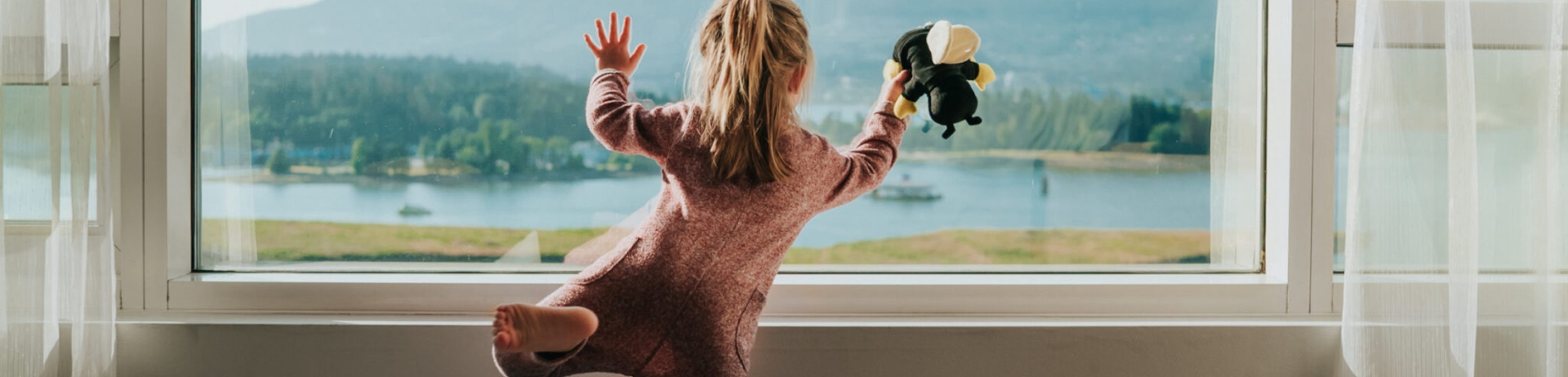 A child playing in a hotel room