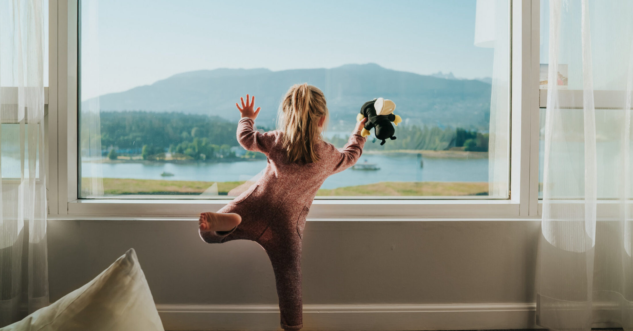 A child playing in a hotel room