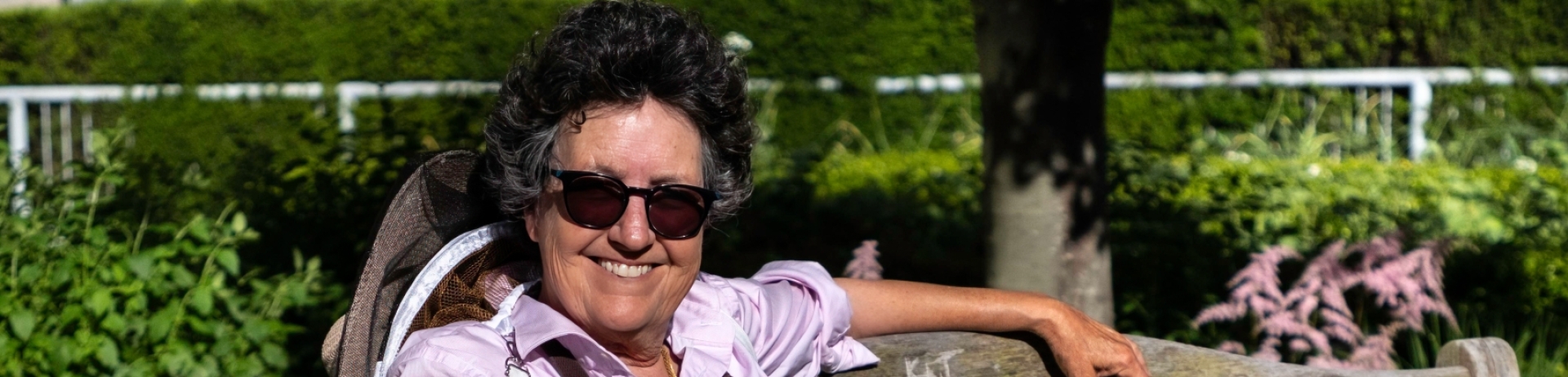 Fairmont Waterfront's Chief Beekeeper Julia Commons sitting on a bench.