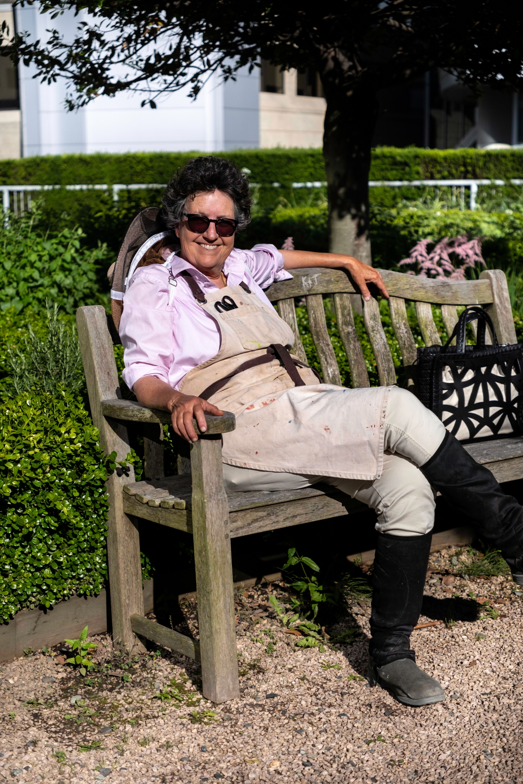 Fairmont Waterfront's Chief Beekeeper Julia Commons sitting on a bench.