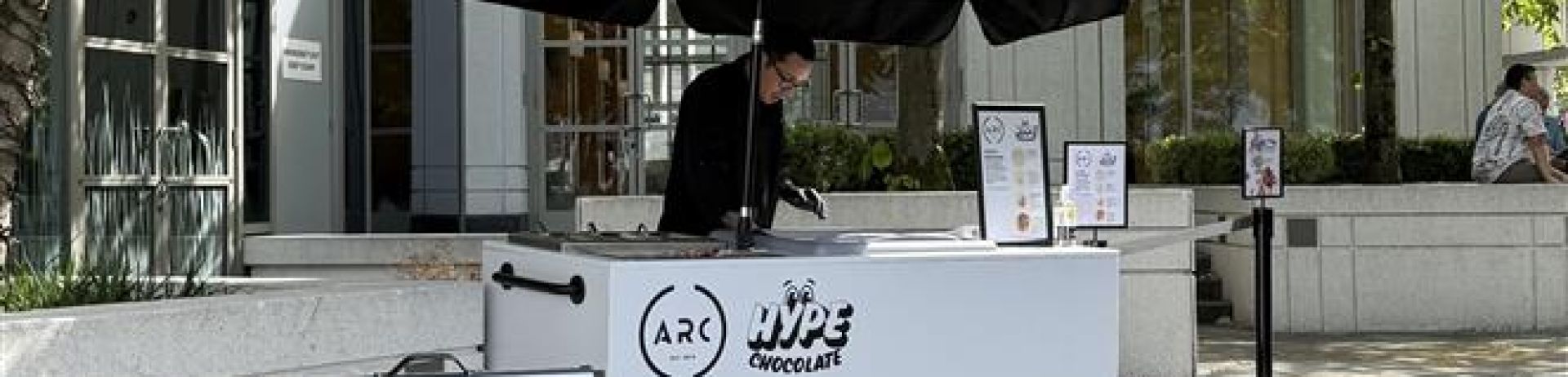 Co-founded by Scott Symons HYPE Chocolate cart. ARCs patio - company loco