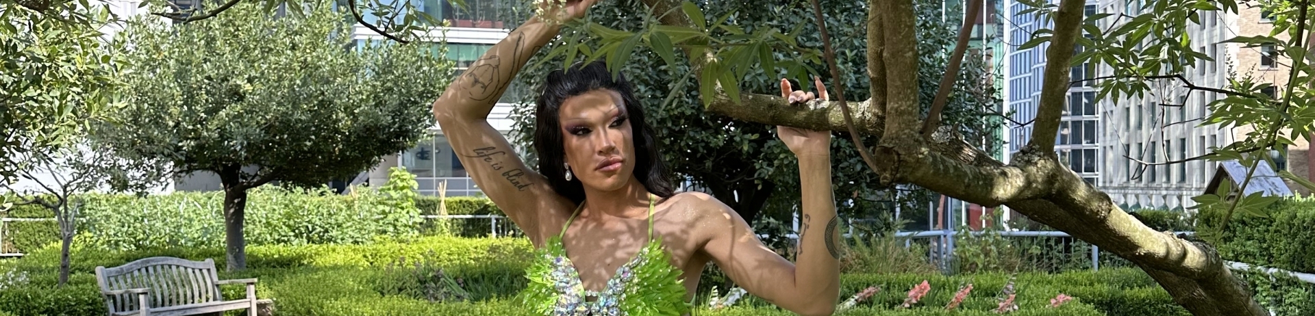 Drag Queen Superstar Kendall Gender posing in Fairmont Waterfront's rooftop garden for Pride