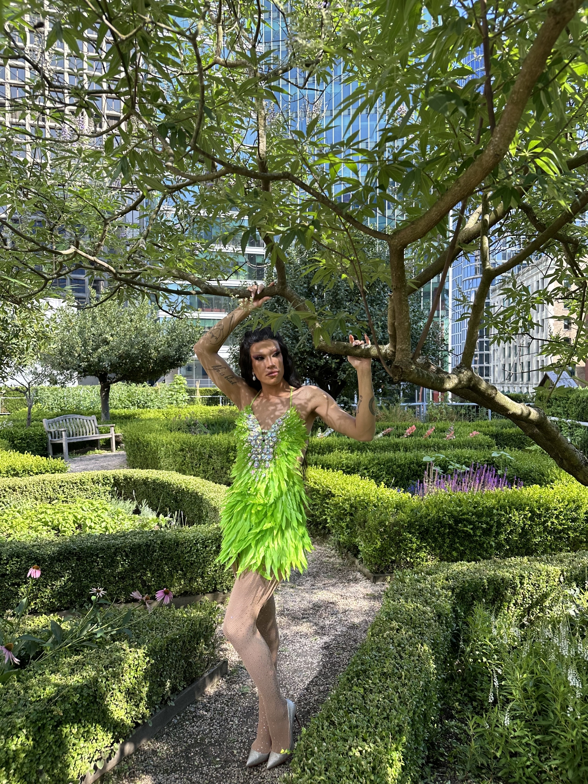 Drag Queen Superstar Kendall Gender posing in Fairmont Waterfront's rooftop garden for Pride