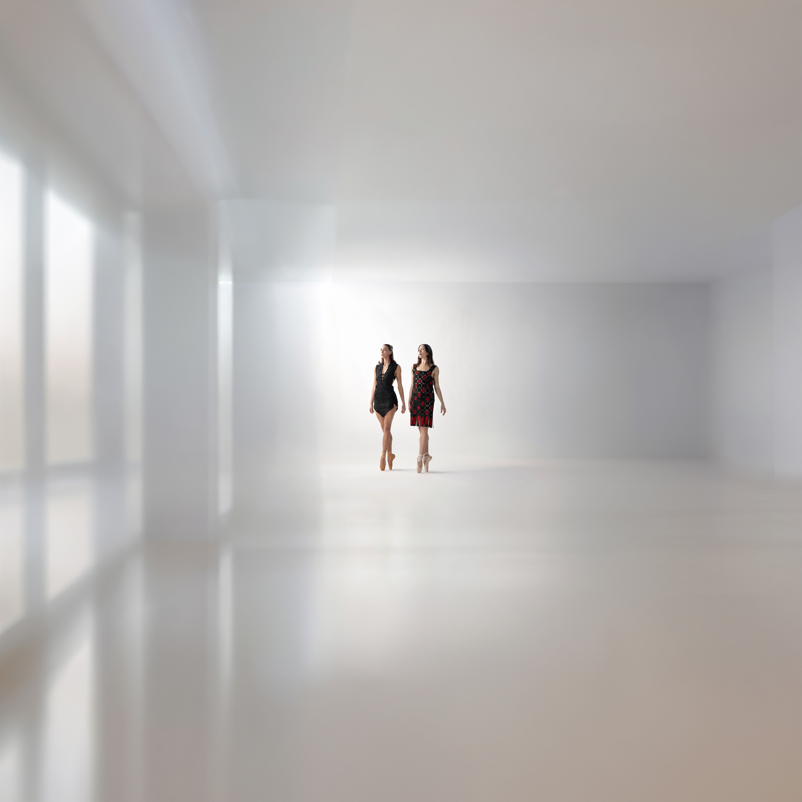 A ballet dancer in mid-air pose highlighting the Indigenous designs of Yolanda Skelton.