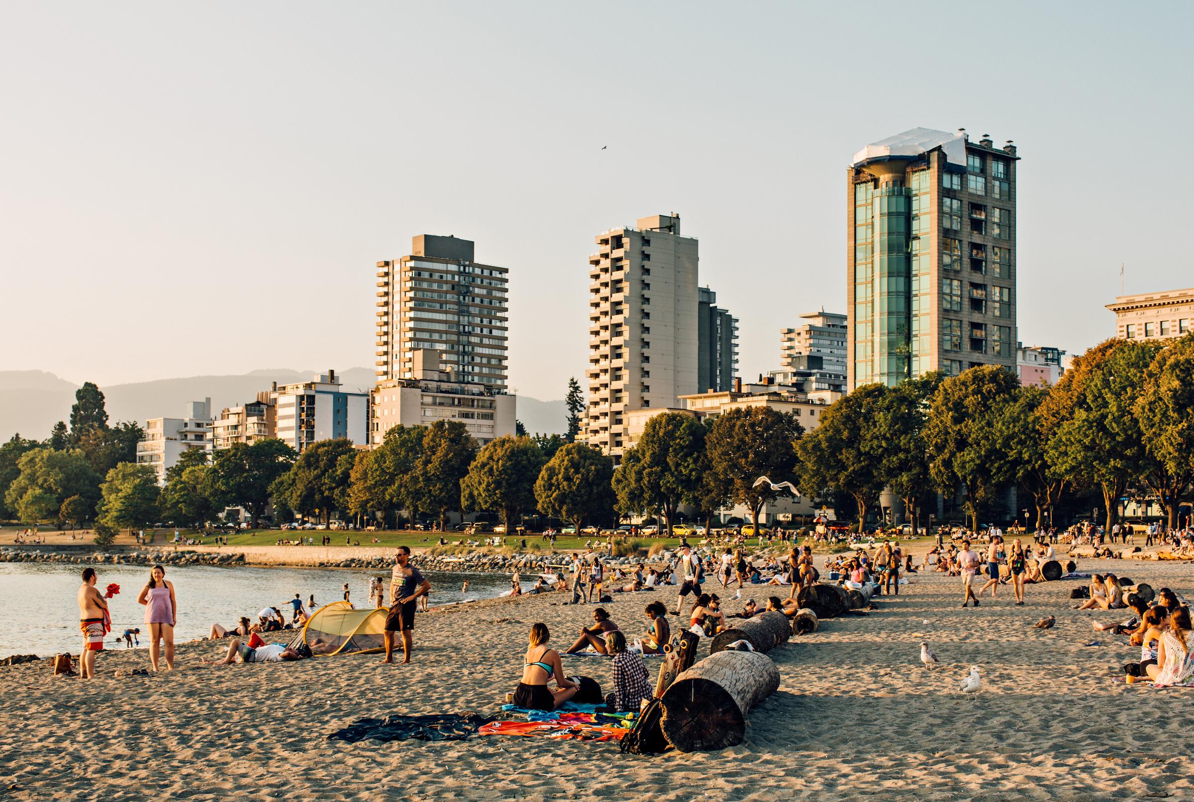 Golden hour with people at English Bay Beach in Vancouver