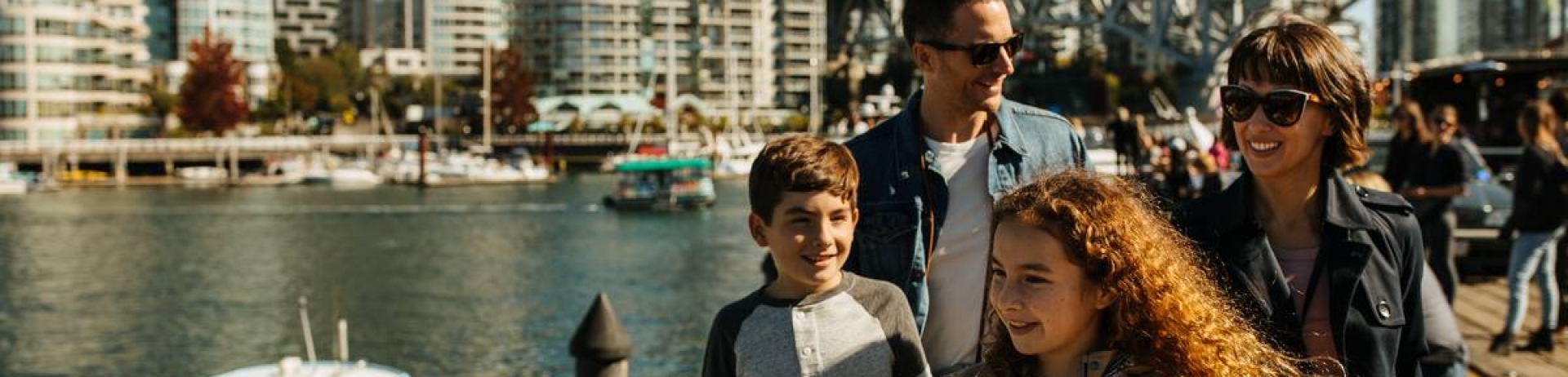 Family walking outside at Granville Island